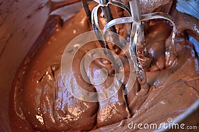 Closeup of chocolate cake mix with beaters. Stock Photo