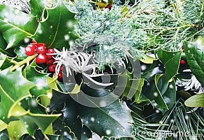 Closeup of Christmas crowns composition. Top view of pine and bay tree branches - Vintage retro Christmas concept with snow Stock Photo