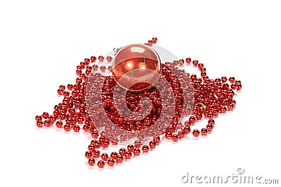 Closeup of a Christmas red pearl beaded chain with a red ball isolated on a white background Stock Photo