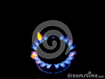 Closeup of circular burner blue and yellow flame Stock Photo