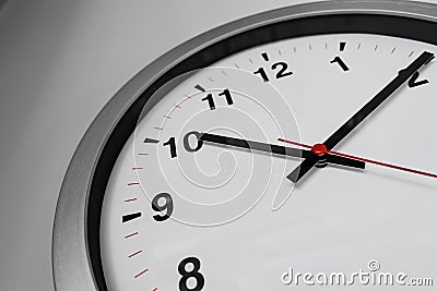 Closeup clock on the wall for Business hours Stock Photo