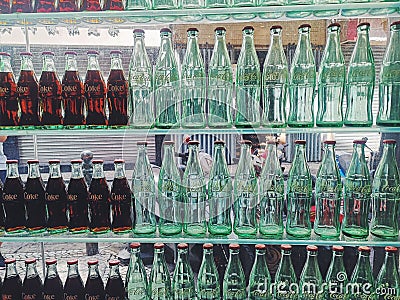 Closeup of Coca Cola glass bottles in store Editorial Stock Photo