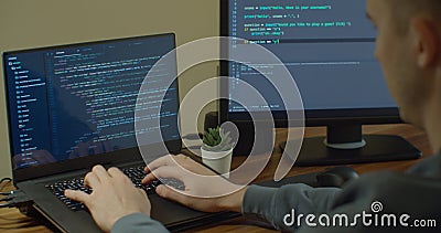 Closeup coding on screen, Man hands coding html and programming on screen Monitors, development web, developer. Stock Photo