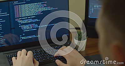 Closeup coding on screen, Man hands coding html and programming on screen Monitors, development web, developer. Stock Photo