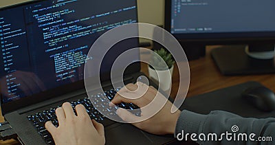 Closeup coding on screen, Man hands coding html and programming on screen Monitors, development web, developer. Stock Photo