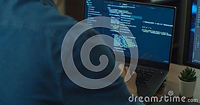 Closeup coding on screen, Man hands coding html and programming on two screen Monitors, development web, developer. Stock Photo