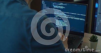 Closeup coding on screen, Man hands coding html and programming on two screen Monitors, development web, developer. Stock Photo