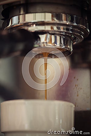 Closeup of coffee machine making espresso drink Stock Photo