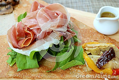 Closeup Cold Cuts Ham with Fresh and Saute Vegetables of an European Appetizer Crepe Stock Photo