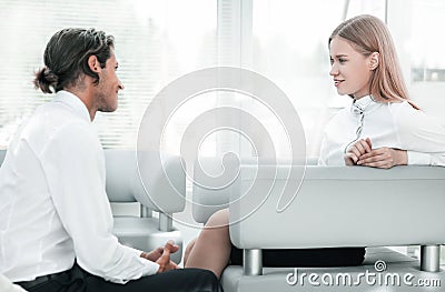 Closeup.colleagues talking ,sitting in the lobby of the office Stock Photo