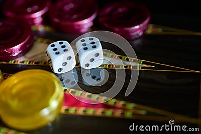 A closeup of a colorful Backgammon with dice showing double six on it on the table Stock Photo