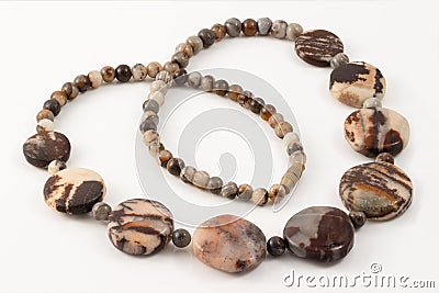 Closeup colorful beads from fossil jasper on white Stock Photo