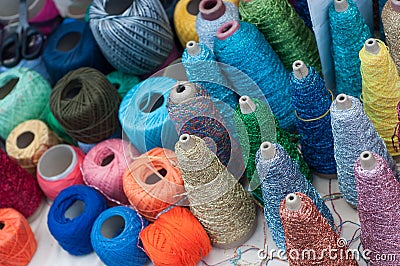 Colorful bobbins of various threads at the market Stock Photo