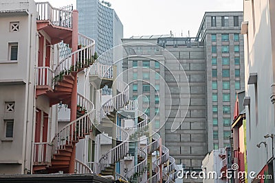 Closeup colorful exterior spiral staircases of shophouse, Singapore Stock Photo