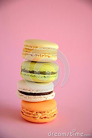 Closeup of colorful macaroons on a pink background. Stock Photo