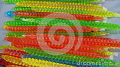 Closeup of colorful plastic jelly in the tubes. Stock Photo