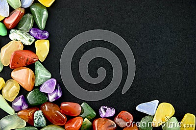 Closeup colorful stones on black background Stock Photo