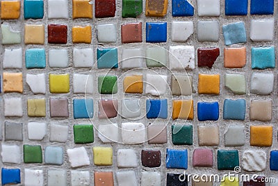 Closeup of a colorful wall with small square mosaics Stock Photo