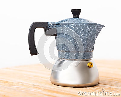 Closeup of moka pot standing on wooden table Stock Photo