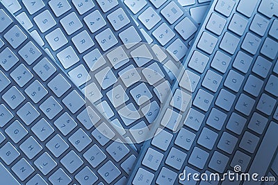 Closeup of computer keyboards on a black dark desk Stock Photo