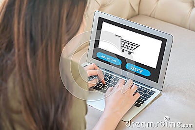 Closeup computer notebook on sofa with asian woman for shopping online in lifestyle of woman concept Stock Photo