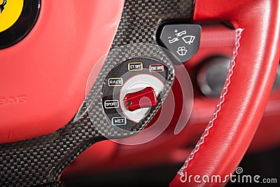 Closeup of the control buttons on a steering wheel of a modern car under the lights Stock Photo
