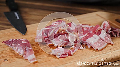 Cook hands cutting bacon. Food, slice. Stock Photo