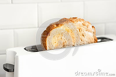 Closeup cooking bread with toaster on counter bar kitchen in morning Stock Photo