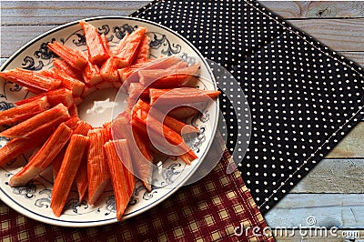 Closeup crab stick in dish on table background Stock Photo