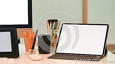 Closeup creative workspace Mockup tablet computer with empty screen display computer equipment Stock Photo