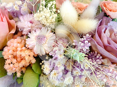 Closeup and crop colorful decorative of dry and paper artificial flowers in bouquet Stock Photo