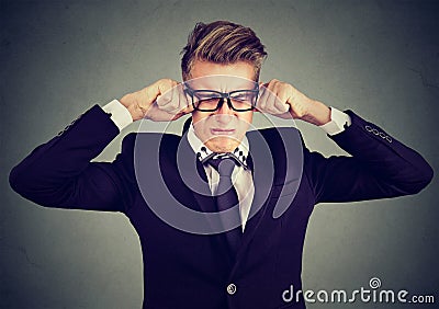 Closeup of a crying man in glasses Stock Photo