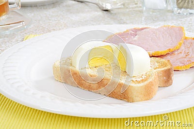 Closeup cut poached egg on toast Stock Photo