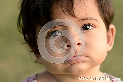 Closeup of cute adorable beautiful face of mixed race baby with Stock Photo