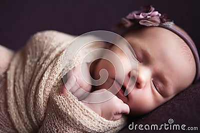 Closeup infant baby girl sleeping at background. Newborn and mothercare concept Stock Photo