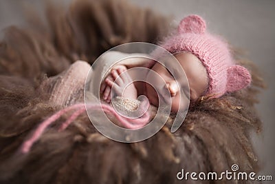 Closeup infant baby girl sleeping at background. Newborn and mothercare concept Stock Photo