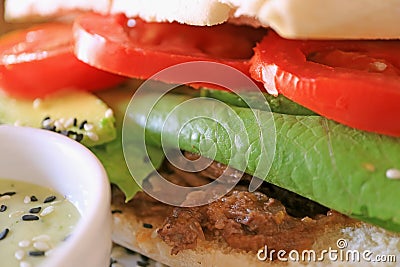 Closeup delectable fresh vegetable and sliced beef sandwich Stock Photo