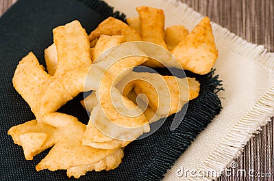 Closeup of delicious ecuadorian pristinos, piled up fresh from the fryer, traditional andean pastry suitable for coffee Stock Photo