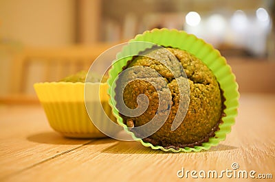 Closeup of a delicious muffin in a green baking silicone mold Stock Photo