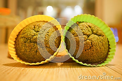 Closeup of delicious muffins in a green and yellow baking silicone molds Stock Photo