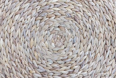 Closeup detail of A circle knitted fabric weaving mat or pad with round pattern for table protection from heat ,background texture Stock Photo