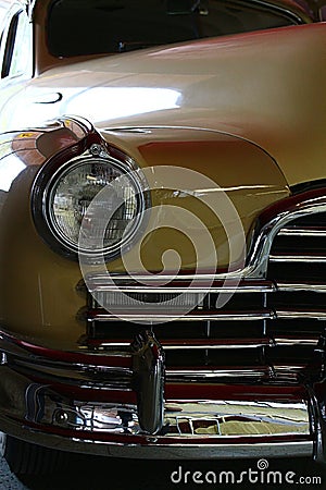 Closeup detail of massive front mask and round headlights of american full size retro car Pontiac Torpedo from year 1946 Editorial Stock Photo