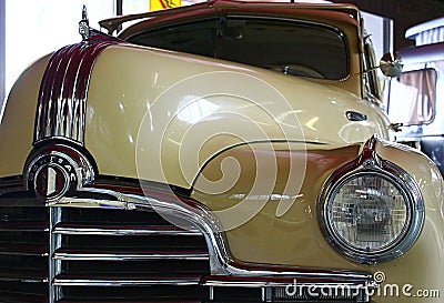 Closeup detail of massive front mask and round headlights of american full size retro car Pontiac Torpedo from year 1946 Editorial Stock Photo