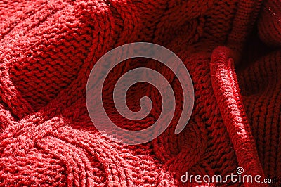 Closeup of the details and textures of a red coat made from sheep's wool Stock Photo