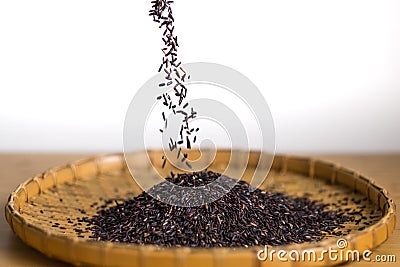 Closeup details of Thai rice berry in bamboo black grounds Stock Photo