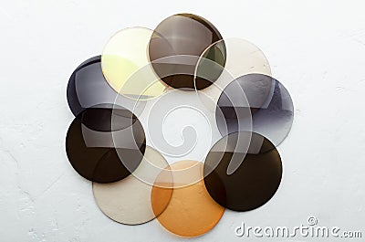 Closeup of optical colorful lenses that made a shape of circle on the white surface Stock Photo