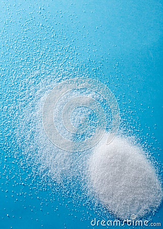 Closeup different shapes of sugar on blue background Stock Photo