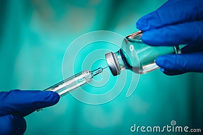 Closeup of a doctor with a bottle of vaccine. Coronavirus Covid-19 Protection and Vaccination Stock Photo