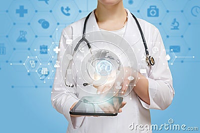 A doctor using her gadget for working with online global medical system Stock Photo