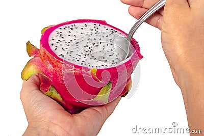 Closeup Of A Dragon Fruit Being Scooped Stock Photo